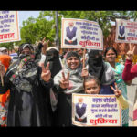 Muslim women participating in a Waqf Board community meeting